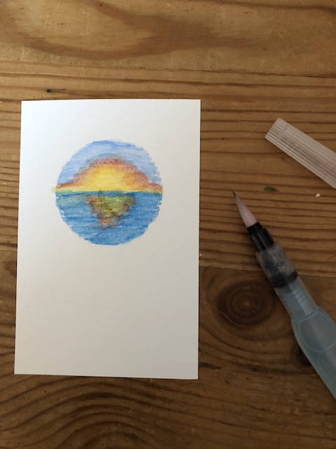 Grußkarte mit Sonnenuntergang, der erst mit den Aquarellstiften von Stampin' Up gemalt wurde und dann mit einem Wassertankpinsel in Form gebracht wurde.