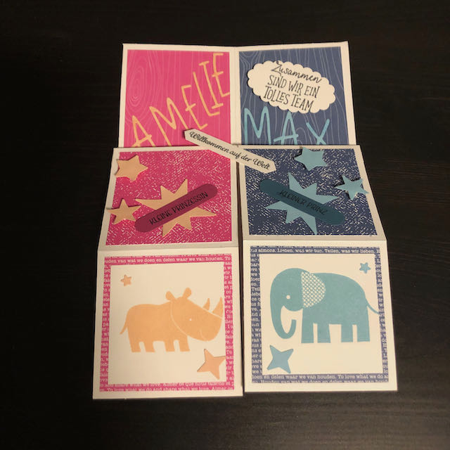 Triple Pop Up Cube Card für Zwillinge. Die Karte ist in Pink und Blau gebastelt. Die Seite für Amelie ist pink mit Sternen und einem Nashorn und die Seite für Max ist blau mit Sternen und einem Elefanten. 