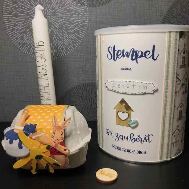 Swaps von Anja: zwei Eierkarton dekoriert mit einem Osterhasen, eine Kerze mit Frühlingsgruß und eine runde Box