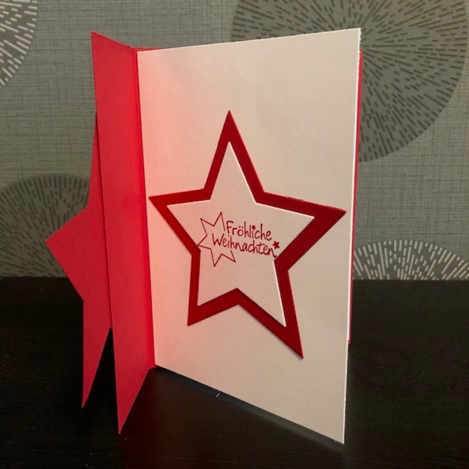 Weihnachtskarte 2022 mit einem Stern zum Aufklappen und dem Spruch: Frohe Weihnachten